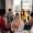 Diverse group of people sitting in circle in group therapy session.